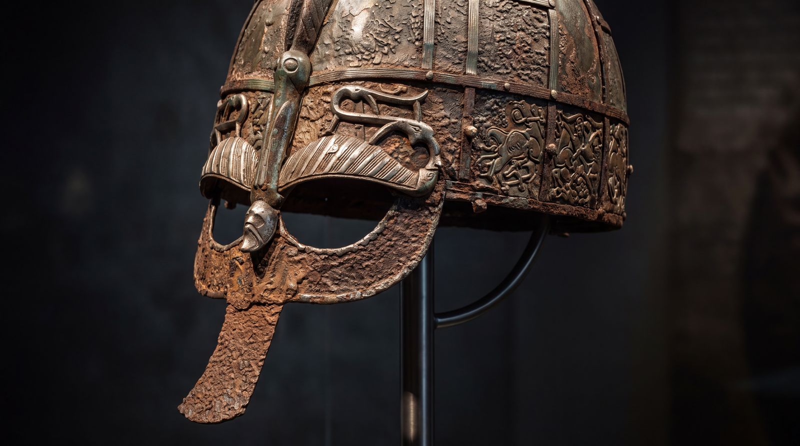 Illustration: a decorated iron helmet in the style of those found at Sutton Hoo